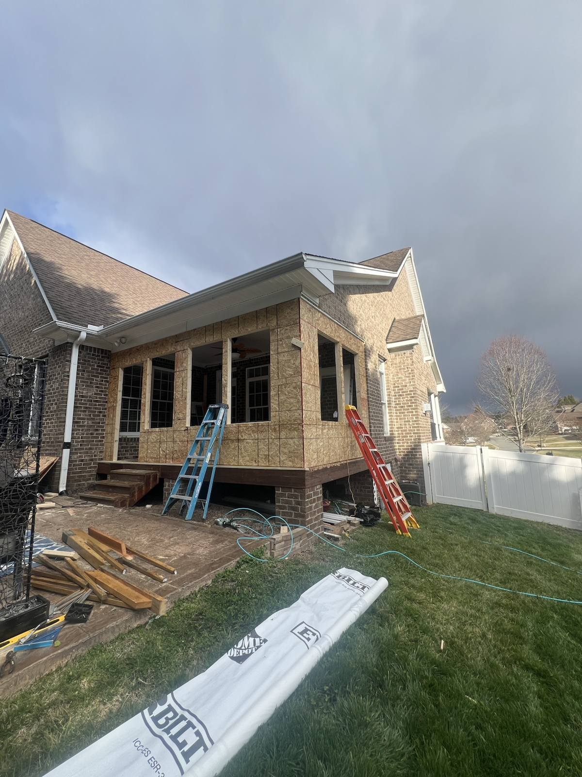 Open porch area before enclosure work by Marco's Home Improvement & Remodeling